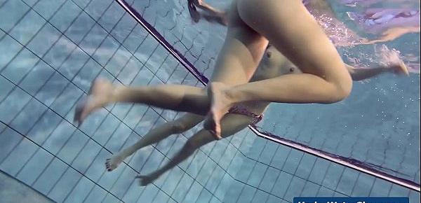  Horny girls strip eachother in the pool